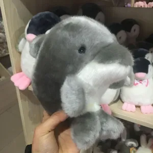 Detailed view of the cute gray and white plush animal toy, soft fabric texture and cute design.