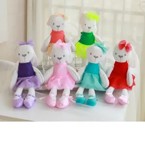 Detailed view of cute rabbit plush dolls in colorful lace ballet dresses, soft soothing toys.