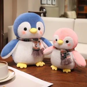Cute penguin plush toy detail view, soft stuffed doll with plaid scarf, perfect kids gift.