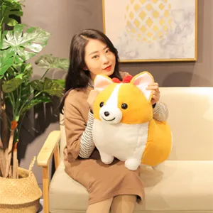 Detailed shot of a cute short-legged corgi plush toy held by a model in a cozy living room.