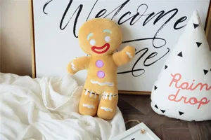 Cute gingerbread man plush toy detail, soft stuffed doll pendant for kids room decoration.
