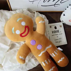 Close-up detail of the cute gingerbread man plush doll toy, soft fabric and cozy home decor.