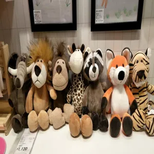 Detailed view of cute forest animal plush toys set featuring lion elephant giraffe and monkey.