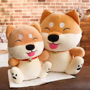 Close-up detail of cute smiling Shiba Inu plush toy dolls sitting together on a book scene.
