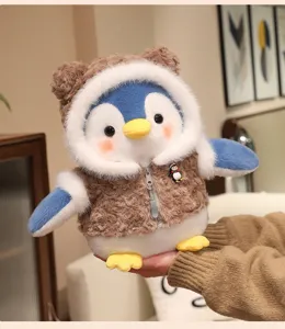 Cute penguin plush toy detail featuring soft brown hoodie and lovely facial expression.