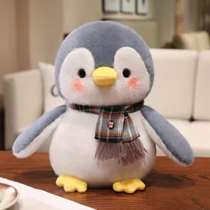 Cute penguin plush toy with scarf, soft stuffed animal doll for kids, perfect Christmas gift.
