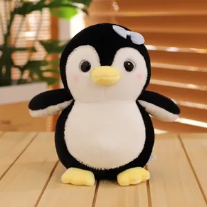 Simpatico pinguino di peluche giocattolo animale imbottito con fiocco bambola morbida