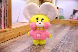 Cute yellow plush toy doll with big ears and pink sweater, soft stuffed cartoon animal for kids.