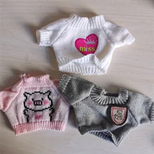 Cute knitted doll sweater set for plush toys, mini clothes in white, pink, and grey styles.