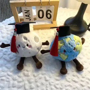 Cute graduation planet moon plush toy detail, soft stuffed doll companion for kids decoration.
