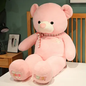 Large pink teddy bear plush toy shell with cute heart embroidery and checkered bow decor.