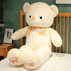 Large plush teddy bear toy with heart embroidery and check bow, soft cute stuffed doll.