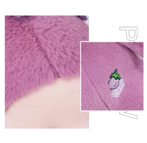 Cute purple vegetable plush toy detail shot, soft stuffed eggplant doll pillow for kids.
