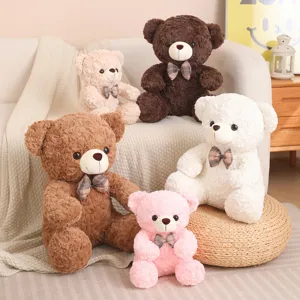 Cute sitting teddy bear plush toys in various colors with plaid bows for decoration detail.
