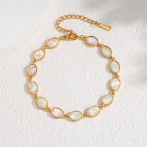 Gold plated oval bezel abalone shell bracelet detail view, elegant mother of pearl wrist jewelry.