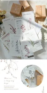 Vintage botanical wooden stamps and decorative memo paper set for journal crafting arts.