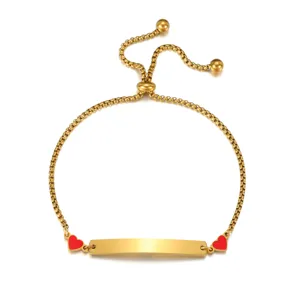 Gold stainless steel ID bracelet with red enamel heart charms and adjustable sliding chain.