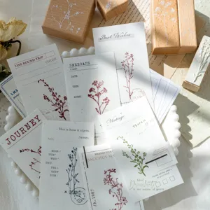 Wooden stamps and vintage botanical journal stickers set for creative scrapbooking crafts.