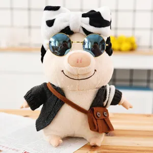 Cute plush pig toy dressed in black sweater and sunglasses with cow pattern bow for kids gift.