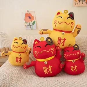 Detailed view of cute lucky cat plush toy, soft stuffed doll with golden bell and Chinese text.