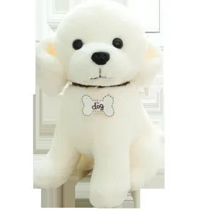 Cute white plush puppy dog toy with a bone tag, sitting upright in studio shot main image.