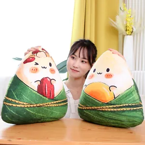 Detailed view of cute cartoon Zongzi plush pillows with soft fabric and vivid printing design.