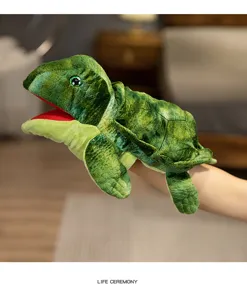 Detailed close-up view of green turtle plush hand puppet showing realistic open mouth design.