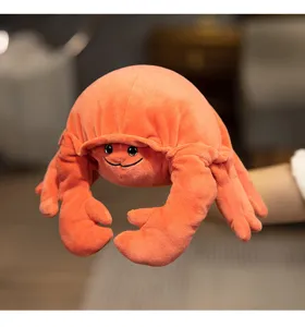 Close-up of cute orange crab plush hand puppet toy, soft fabric and interactive design details.