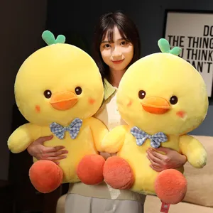 Cute bowknot little yellow duck plush toy, soft stuffed doll, perfect gift for kids.