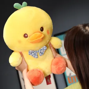 Cute yellow duck plush toy with blue plaid bow tie, soft stuffed doll for kids gift.