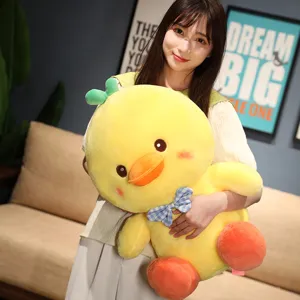 Cute yellow duck plush toy with blue plaid bow tie, soft stuffed animal doll for kids gift.