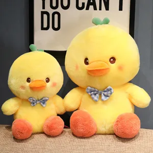 Cute bow tie little yellow duck plush toy doll, soft stuffed animal for kids and gifts.