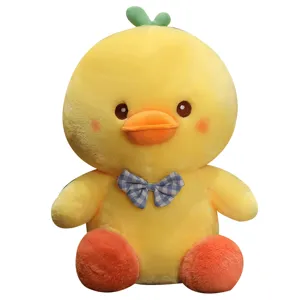 Cute yellow duck plush toy with blue checkered bow, soft stuffed doll for kids main view.
