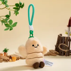 Cute cartoon mini plush doll bag pendant, soft root vegetable design with green lanyard.
