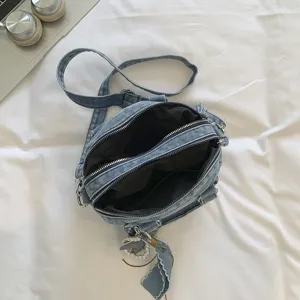 Denim boston bag casual fashion student shoulder crossbody handbag with pearl pendant zipper design.