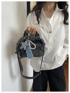 Black denim Boston bag with shoulder strap, star charm and pearls for women commuting.