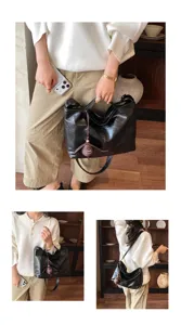 Vista detallada del elegante bolso de hombro negro de cuero con gran capacidad.