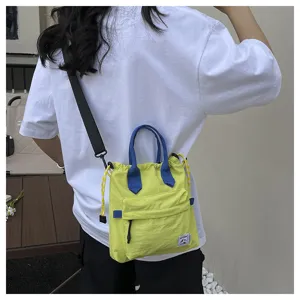 Sac bandoulière élégant pour femmes avec cordon de serrage, poignées doubles et design chic.