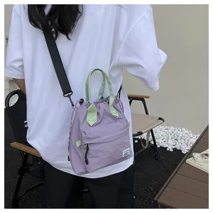Sac seau coulissant violet style coréen avec poignées vertes bandoulière décontractée pour femmes.