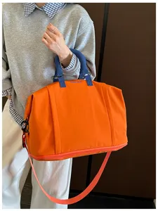 Large capacity travel duffel bag with shoulder strap, expandable design for outdoor trips.