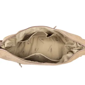 Corduroy schoudertas interieur detail met ruim vak en handige voeringzakken.