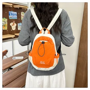 Detail view of the color-block outdoor backpack with drawstring and mesh side pockets for travel.