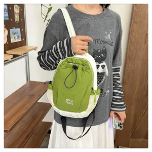 Outdoor contrast color mini backpack detail, green and white drawstring casual daypack view.