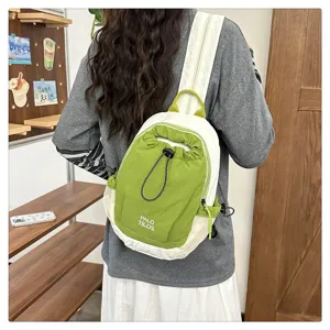 Color-blocking outdoor backpack with drawstring and mesh pockets, lightweight travel bag.