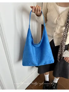 Blue suede slouchy shoulder bag, casual everyday vintage style tote for women and daily use.