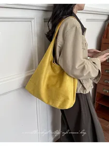 Retro yellow suede shoulder bag for women, large capacity casual tote daily commute.