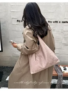 Casual vintage style women's suede shoulder bag large capacity solid color tote bag for daily commute.