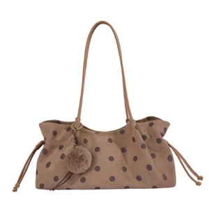 Brown polka dot shoulder tote bag with furry pom pom charm for women daily commuting.