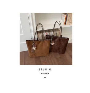 Stylish brown suede tote bag with cute bear charm, large capacity shoulder bag for women.