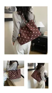 Detailed showcase of the brown polka dot shoulder tote bag designed for casual daily commute.